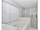 This bathroom has a jetted tub, a shower and marble countertop adding a touch of luxury at 5331 Old Hickory Ln, Fruitland Park, FL 34731
