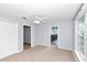 Sun-filled bedroom with ceiling fan, a closet with double doors and ensuite bathroom at 5331 Old Hickory Ln, Fruitland Park, FL 34731