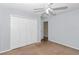 Simple bedroom with carpet, ceiling fan, and a closet for storage at 5331 Old Hickory Ln, Fruitland Park, FL 34731
