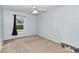 Cozy bedroom with natural light and a carpeted floor at 5331 Old Hickory Ln, Fruitland Park, FL 34731
