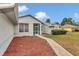 Charming home featuring a well-maintained lawn, fresh mulch, and inviting walkway at 5331 Old Hickory Ln, Fruitland Park, FL 34731