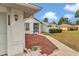 Charming home featuring a well-maintained lawn, fresh mulch, and inviting walkway at 5331 Old Hickory Ln, Fruitland Park, FL 34731