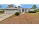 Charming single-story home featuring an attached two-car garage and a well-manicured front yard at 5331 Old Hickory Ln, Fruitland Park, FL 34731