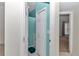 Hallway view showing access to a bathroom and an adjacent room, highlighting connectivity at 5331 Old Hickory Ln, Fruitland Park, FL 34731