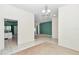 Spacious living room with tiled floors and a connecting open floorplan at 5331 Old Hickory Ln, Fruitland Park, FL 34731