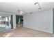 Open living room showcasing access to the pool area and a glimpse into the kitchen at 5331 Old Hickory Ln, Fruitland Park, FL 34731