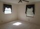 Bedroom with tile flooring and lots of natural light from two windows at 5355 Sw 31St St, Ocala, FL 34474