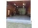 Interior of the large garage with a car lift and fluorescent lighting throughout at 5355 Sw 31St St, Ocala, FL 34474