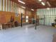 Inside the garage is a car lift, work bench, tool chest, and ample space at 5355 Sw 31St St, Ocala, FL 34474