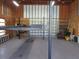 Garage interior, with a car lift, shelves, and work space at 5355 Sw 31St St, Ocala, FL 34474