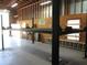 Garage featuring car lift, fluorescent lighting, and ample room at 5355 Sw 31St St, Ocala, FL 34474