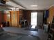 An organized garage featuring a workbench, storage shelves, and access to the outdoors at 5355 Sw 31St St, Ocala, FL 34474
