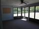 The interior of the screen porch allows you to enjoy the outdoors while protected from the elements at 5355 Sw 31St St, Ocala, FL 34474
