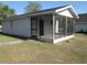 Exterior view of the screened in porch of the house with access to the backyard at 5355 Sw 31St St, Ocala, FL 34474