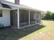 Enclosed screened porch area to enjoy the outdoors with a ceiling fan at 5355 Sw 31St St, Ocala, FL 34474