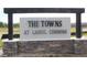 Attractive community sign for 'The Towns at Laurel Commons' shows quality craftsmanship with stone base and modern design at 6589 Sw 81St Loop, Ocala, FL 34476
