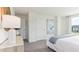 Well-lit bedroom with grey carpet, white walls and trim, and minimalist décor at 6591 Sw 81St Loop, Ocala, FL 34476