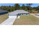 Charming single-Gathering home featuring a two-car garage and well-manicured lawn at 6756 Sw 151St Loop, Ocala, FL 34473