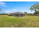 The expansive backyard features a fenced yard and pool at 719 Ne 39Th St, Ocala, FL 34479