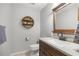 Well-lit bathroom with a modern vanity, a stylish mirror, and a neutral color scheme, creating a relaxing atmosphere at 719 Ne 39Th St, Ocala, FL 34479