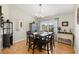 Traditional dining room with hardwood floors, a large window view, and classic furnishings at 719 Ne 39Th St, Ocala, FL 34479