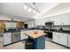 Spacious kitchen featuring granite countertops, stainless steel appliances, and a stylish center island at 719 Ne 39Th St, Ocala, FL 34479