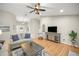 Open living room with tile floors, a ceiling fan, and neutral decor at 719 Ne 39Th St, Ocala, FL 34479