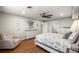 Spacious main bedroom with hardwood floors, a ceiling fan, and neutral decor at 719 Ne 39Th St, Ocala, FL 34479