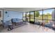 Relaxing screened-in lanai with comfortable seating and a view of the backyard, perfect for outdoor living at 719 Ne 39Th St, Ocala, FL 34479