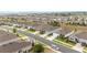 Expansive aerial view showcases a neighborhood featuring well-maintained streets and green spaces at 8090 Penrose Pl, Wildwood, FL 34785