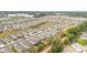 High aerial view shows a dense residential development with a mix of housing and natural elements at 8090 Penrose Pl, Wildwood, FL 34785