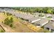 Aerial view showcasing homes with lush backyards, well-kept landscaping, and a serene neighborhood setting at 8090 Penrose Pl, Wildwood, FL 34785