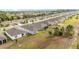 Aerial perspective highlighting a community layout with neatly arranged houses and manicured lawns at 8090 Penrose Pl, Wildwood, FL 34785