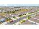 Wide aerial shot displays an orderly suburban layout with similar home designs and landscaping at 8090 Penrose Pl, Wildwood, FL 34785