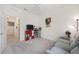 Spare bedroom including an organized storage cube perfect for a or guest at 8090 Penrose Pl, Wildwood, FL 34785