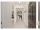 Bright and airy foyer with neutral tile flooring, leading to the living areas at 8090 Penrose Pl, Wildwood, FL 34785