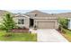 Charming single-Gathering home featuring a two-car garage and a well-manicured front yard at 8090 Penrose Pl, Wildwood, FL 34785
