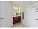 Bathroom with tiled floors and dual access doors at 8955 Sw 86Th Loop, Ocala, FL 34481
