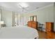 Serene bedroom with hardwood floors and ample closet space at 8955 Sw 86Th Loop, Ocala, FL 34481