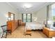 Cozy bedroom with hardwood floors and neutral walls at 8955 Sw 86Th Loop, Ocala, FL 34481