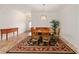 Dining room area showcasing a decorative rug, table set with seating for six and natural light at 8955 Sw 86Th Loop, Ocala, FL 34481