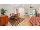 Dining area showcases a decorative rug, table set with seating for six and natural light at 8955 Sw 86Th Loop, Ocala, FL 34481