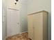 Light and airy entryway featuring tiled floors and a bright, vintage cabinet at 8955 Sw 86Th Loop, Ocala, FL 34481