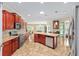 Well-equipped kitchen with stainless steel appliances, granite countertops, a kitchen island, and an open layout at 8955 Sw 86Th Loop, Ocala, FL 34481