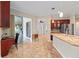 View from kitchen featuring stainless steel appliances, a breakfast bar, and an open layout design at 8955 Sw 86Th Loop, Ocala, FL 34481