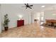 Spacious living room featuring tile flooring, plenty of natural light, and views to the dining area at 8955 Sw 86Th Loop, Ocala, FL 34481