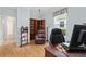 Spacious office with wood floors, and corner bookcase, creating the ideal work atmosphere at 8955 Sw 86Th Loop, Ocala, FL 34481