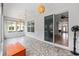 Enclosed patio area featuring decorative flooring, lighting, and views of the exterior and interior at 8955 Sw 86Th Loop, Ocala, FL 34481