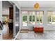 Bright patio with tile floor, ceiling fan, and view of the backyard garden at 8955 Sw 86Th Loop, Ocala, FL 34481
