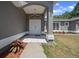 Close up of covered front entryway and the double front doors at 9885 Se 144Th St, Summerfield, FL 34491